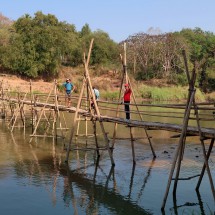 Crossing the northern bamboo bridge over Nam Khan river