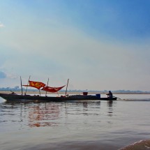 Boat with flying carpets on Rio Ucayali