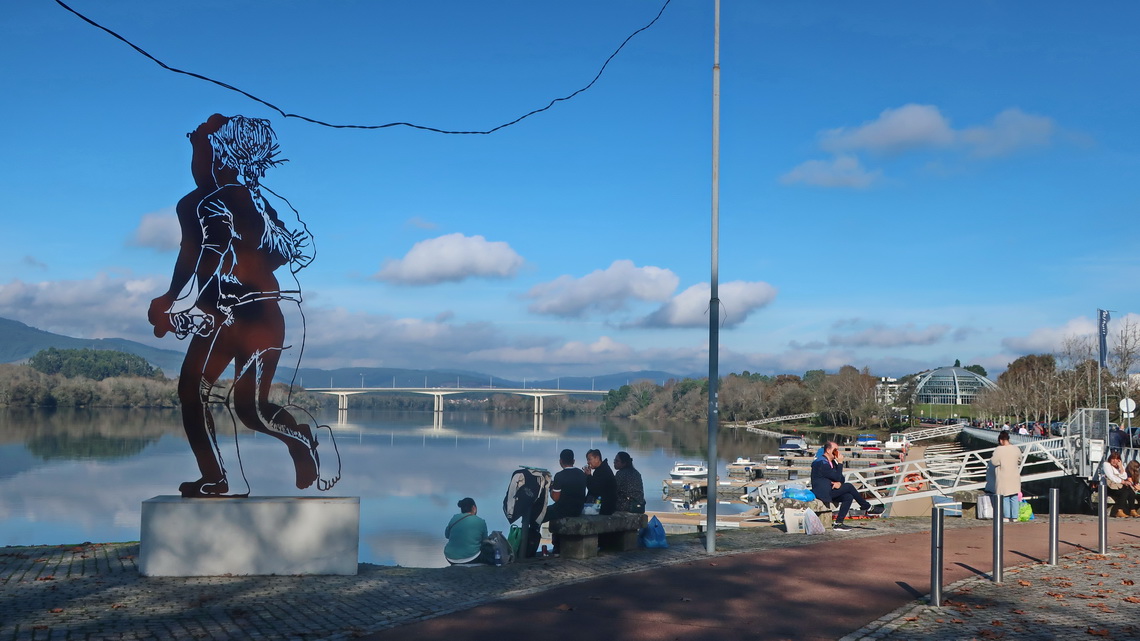 Running girl in Vila Nova de Cerveira on shore of Rio Minho