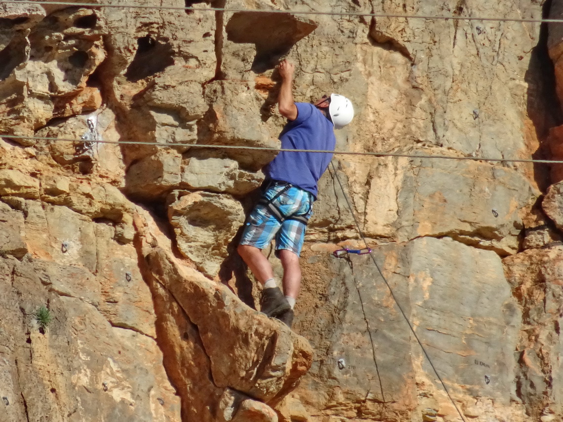 Alfred in the rocks on a challenging part. Note: The two horizontal lines are electricity cables - far away from Alfred