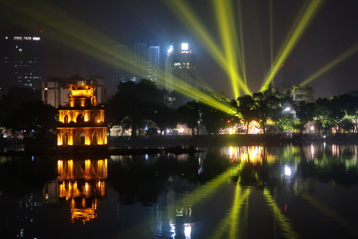 Laser show on Hoan Kiem Lake with Turtle Tower
