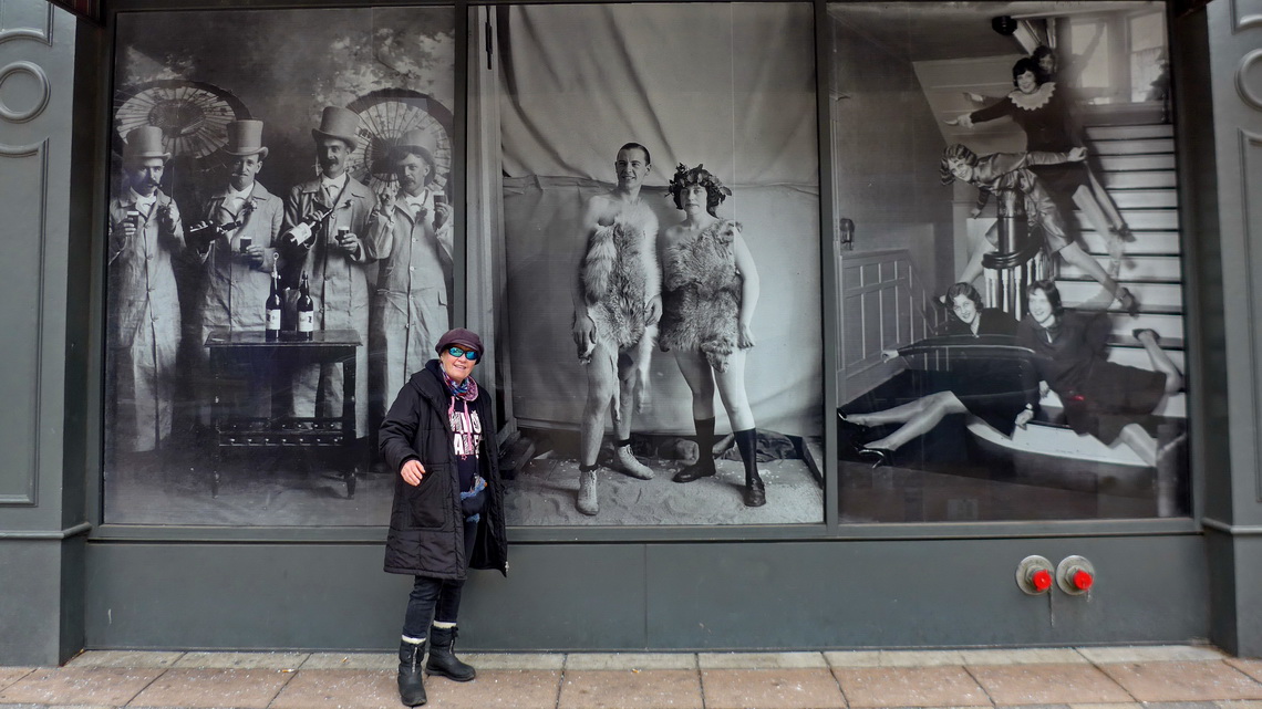 Marion with ancient pictures in the 16th Street Mall of Denver