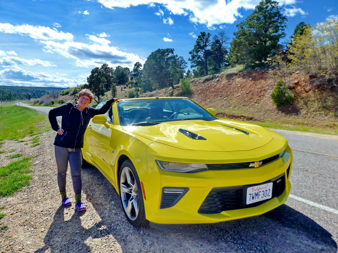 Fancy car with nice Lady between Bryce and Zion Canyons