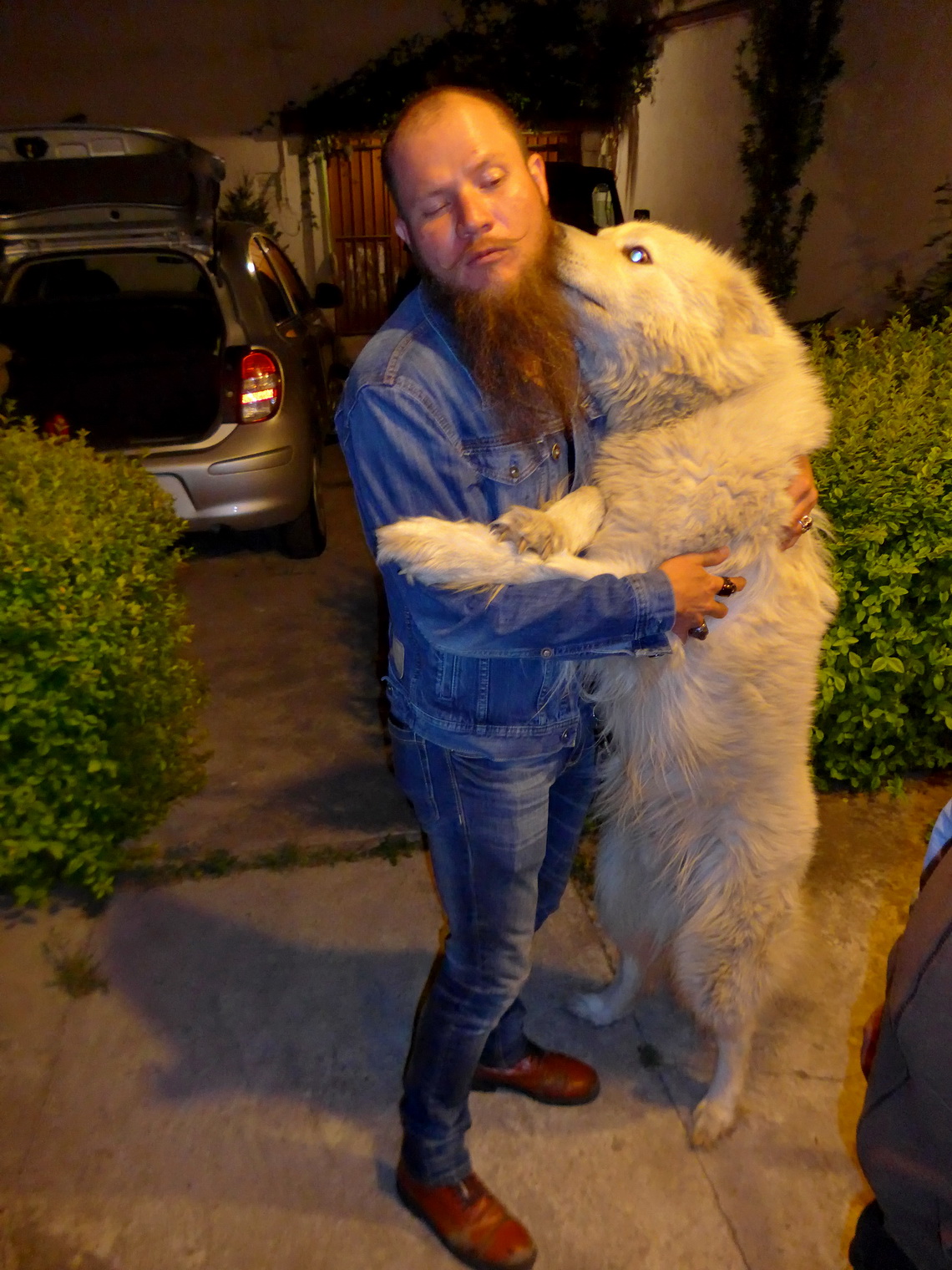 Uncle Poldi embraced by a dog named Whiskey