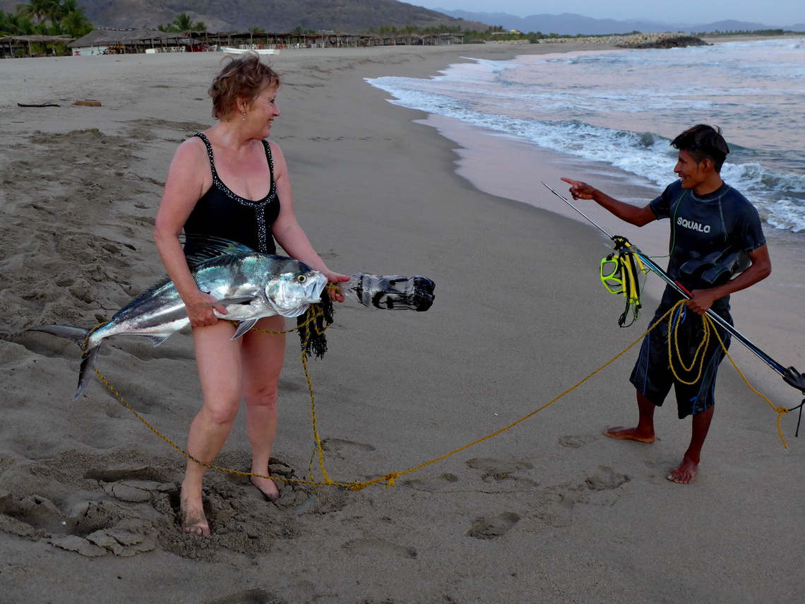 Marion with a big fish and his hunter on Playa Cerro Hermoso