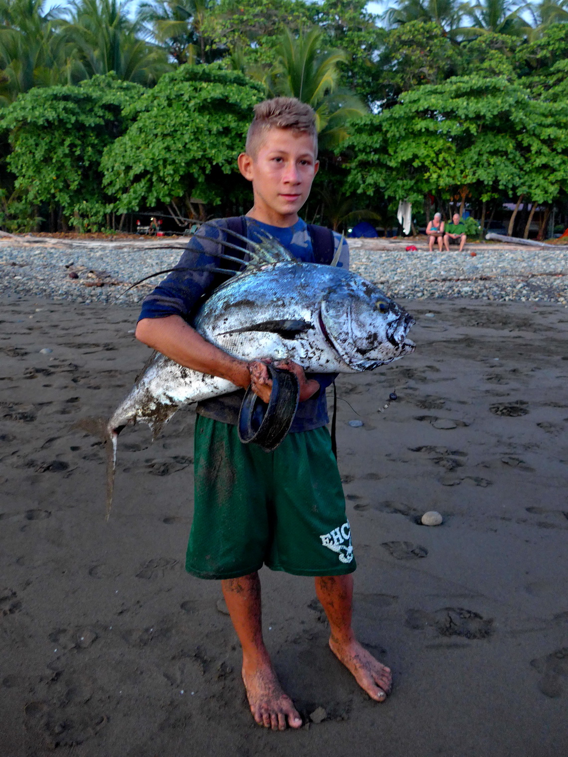 Proud boy on Playa Dominical - He fought more than half an hour to get this big fish
