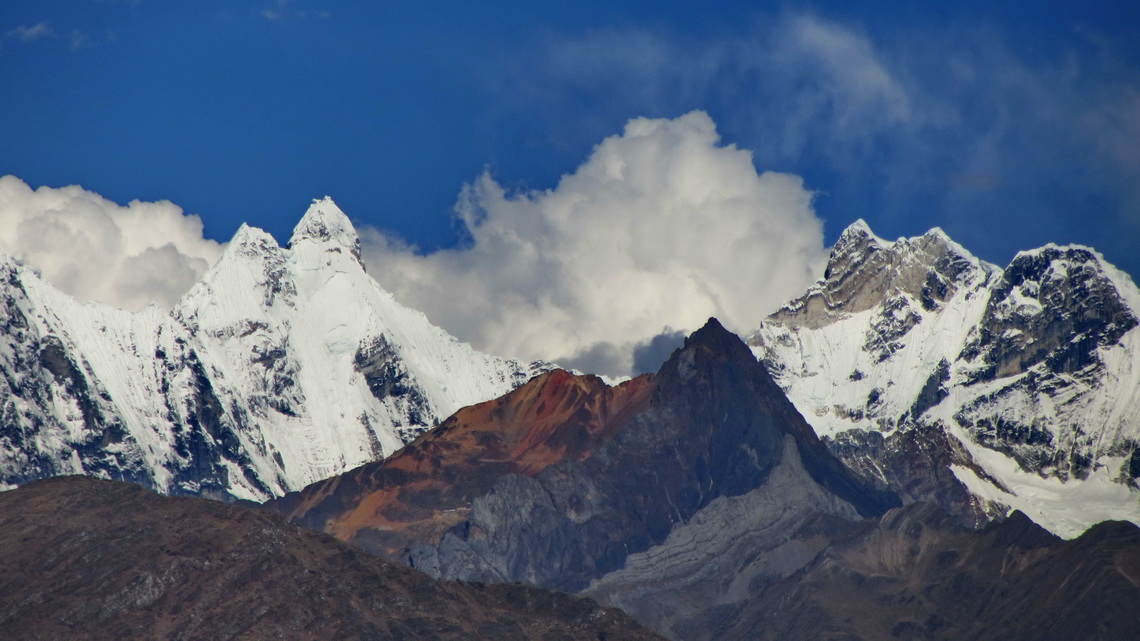 Nevado Jirishanca (left, 6094 meters sea-level), one of the most difficult peaks of the Andes and Nevado Yerupaja Chico (right, 6089 meters sea-level) seen from Chiquian	 	