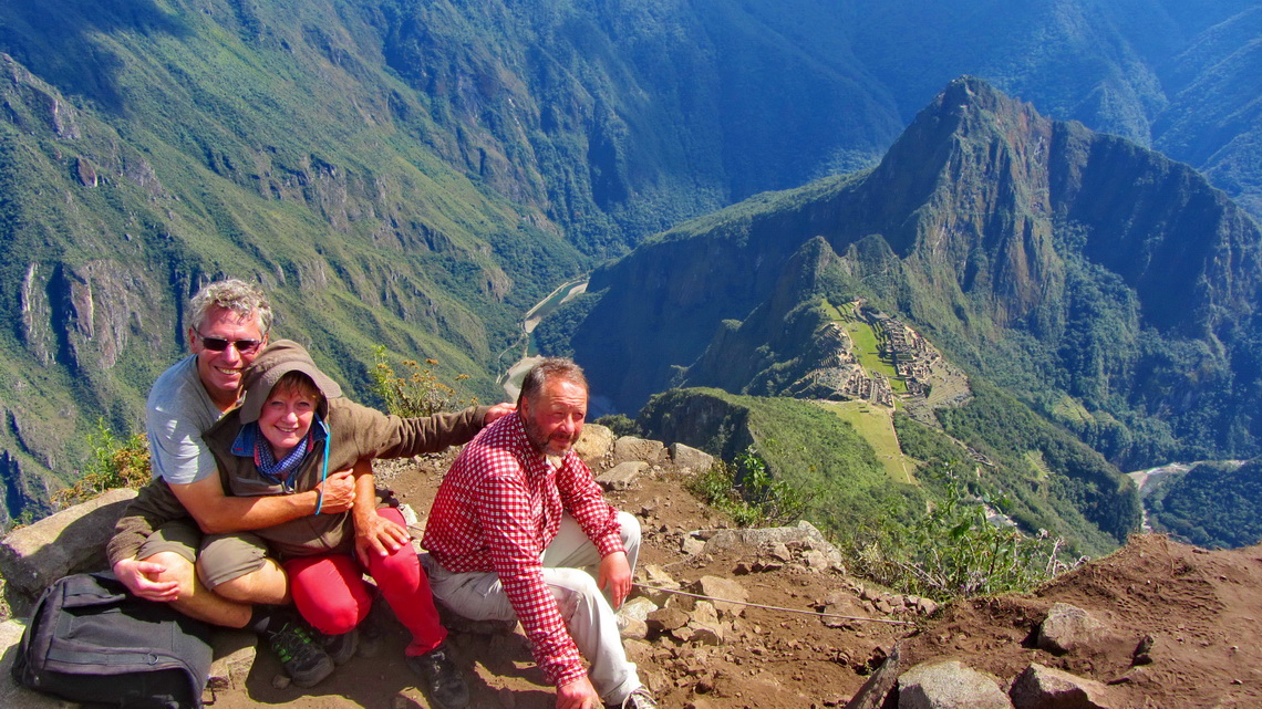 Alfred, Marion and Tommy on the summit of Cerro Machu Picchu with the ancient site and Rio Urubamba in the background