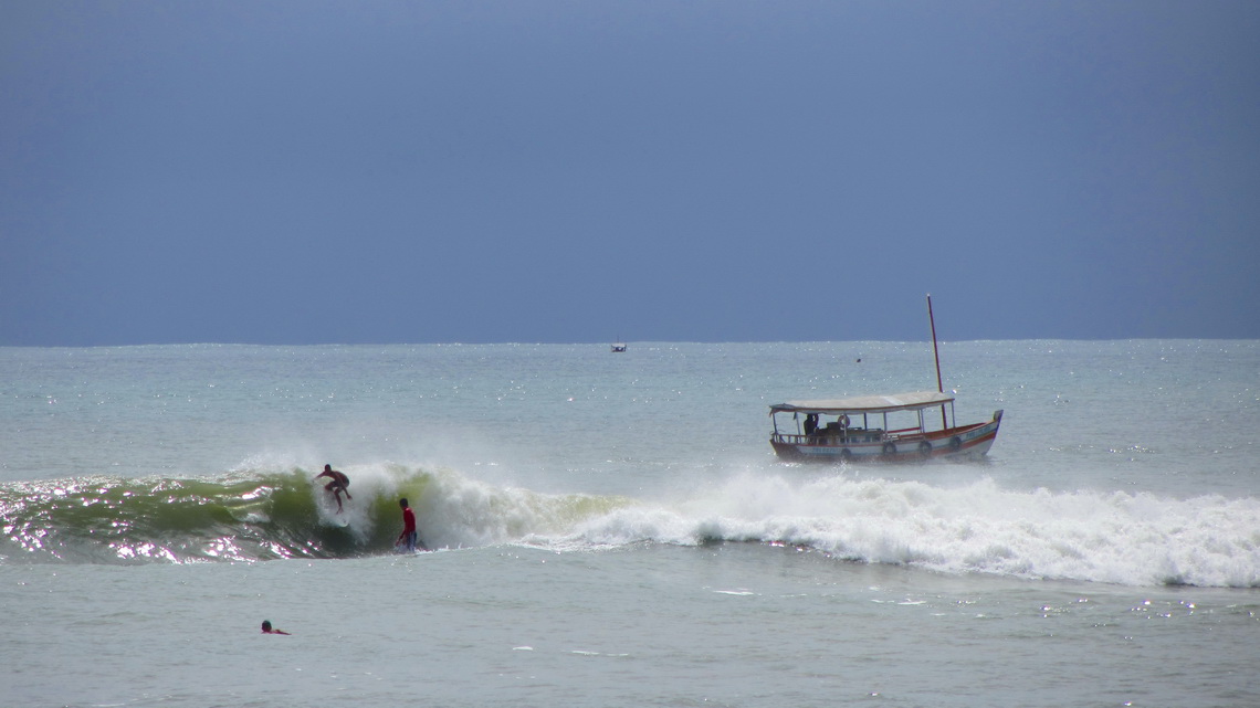 Surfers on the first beach of Morro de Sao Paulo, seen from the patio of our hostel