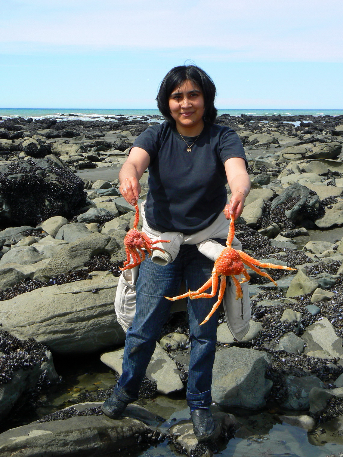 Lucky Argentine girl with two Centollas - Sea Spiders