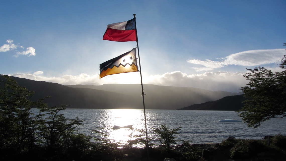 Chilean and Patagonian flags with Lago Grey