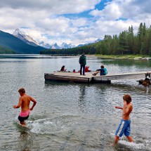 Kuba and Jay entering ice-cold Maligne Lake