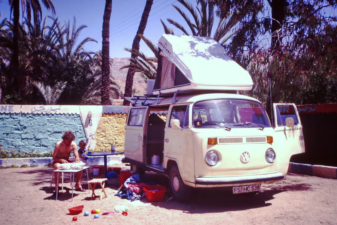 Alfred with our daugther Eva and camper Volkswagen Bully T2 in Tafraout in May 1986